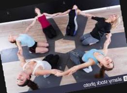 Group Of Youthful Females Sitting In Circle During Yoga Class At Gym Stock Photo Alamy956x1300